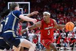 Feb 21, 2026; Louisville, Kentucky, USA;  Louisville Cardinals guard Ryan Conwell (3) dribbles against Georgia Tech Yellow Jackets guard Akai Fleming (0) and center Cole Kirouac (8) during the second half at KFC Yum! Center. Louisville defeated Georgia Tech 87-70. Mandatory Credit: Jamie Rhodes-Imagn Images
