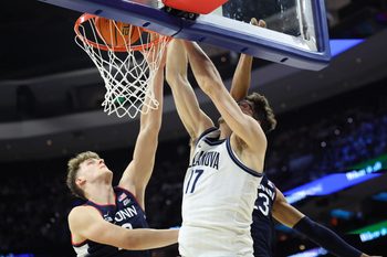 Feb 21, 2026; Philadelphia, Pennsylvania, USA; Villanova Wildcats center Braden Pierce (17) dunks the ball against the UConn Huskies during the second half at Xfinity Mobile Arena. Mandatory Credit: Bill Streicher-Imagn Images