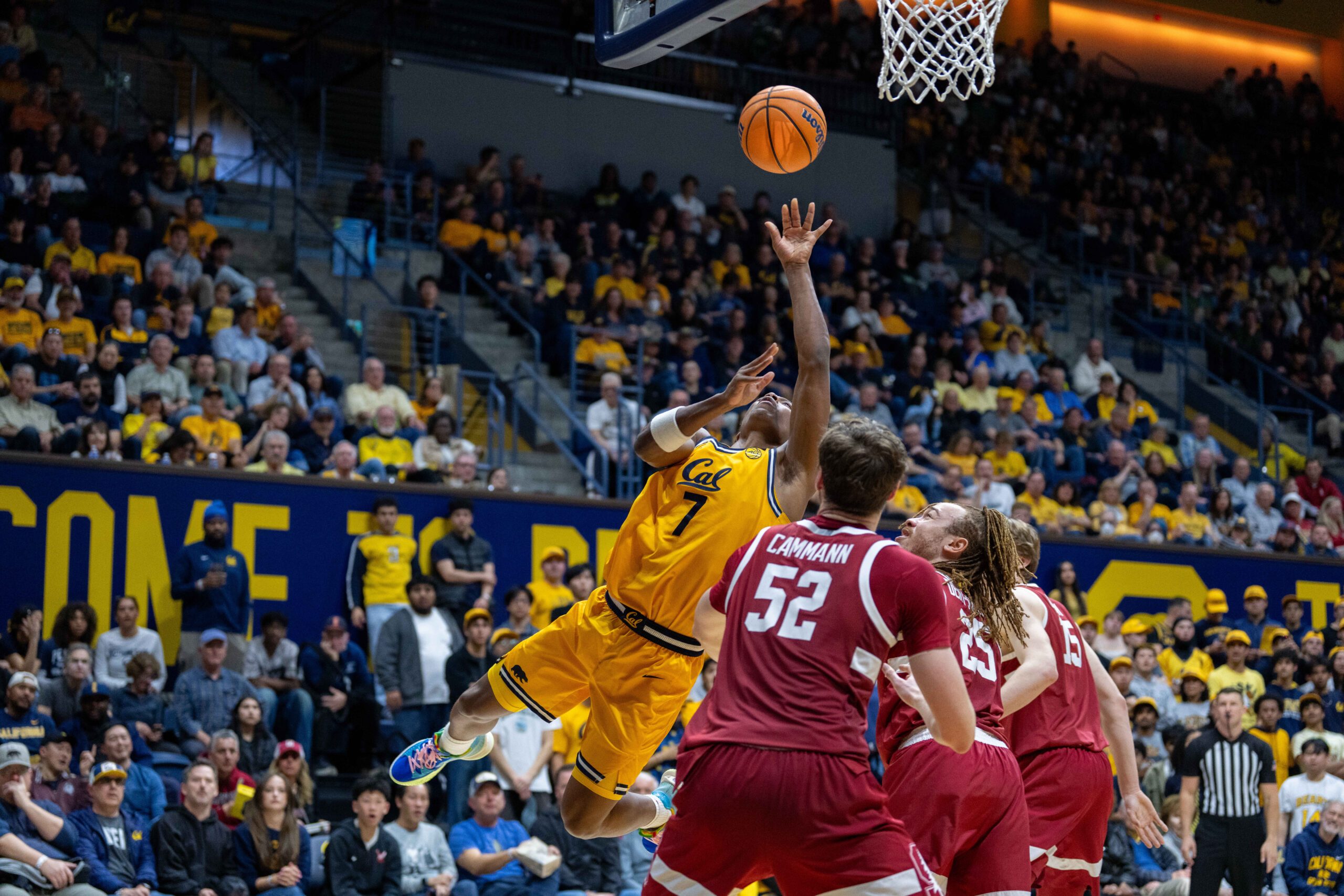Feb 21, 2026; Berkeley, California, USA;  California Golden Bears guard Dai Dai Ames (7) shoots a layup against Stanford Cardinal guard Jeremy Dent-Smith (25) and Stanford Cardinal forward Aidan Cammann (52) during the second half at Haas Pavilion. Mandatory Credit: Neville E. Guard-Imagn Images
