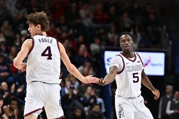 Feb 21, 2026; Spokane, Washington, USA; Gonzaga Bulldogs forward Emmanuel Innocenti (5) and Gonzaga Bulldogs guard Davis Fogle (4) high five during a game against the Pacific Tigers in the second half at McCarthey Athletic Center. Gonzaga Bulldogs won 71-62. Mandatory Credit: James Snook-Imagn Images