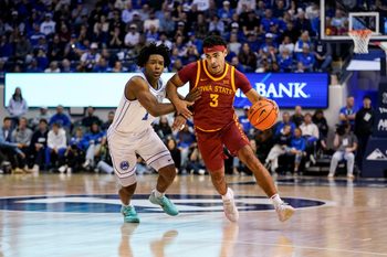 Feb 21, 2026; Provo, Utah, USA; Iowa State Cyclones guard Tamin Lipsey (3) controls the ball while being defended by BYU Cougars guard Robert Wright III (1) during the second half at Marriott Center. Mandatory Credit: Aaron Baker-Imagn Images
