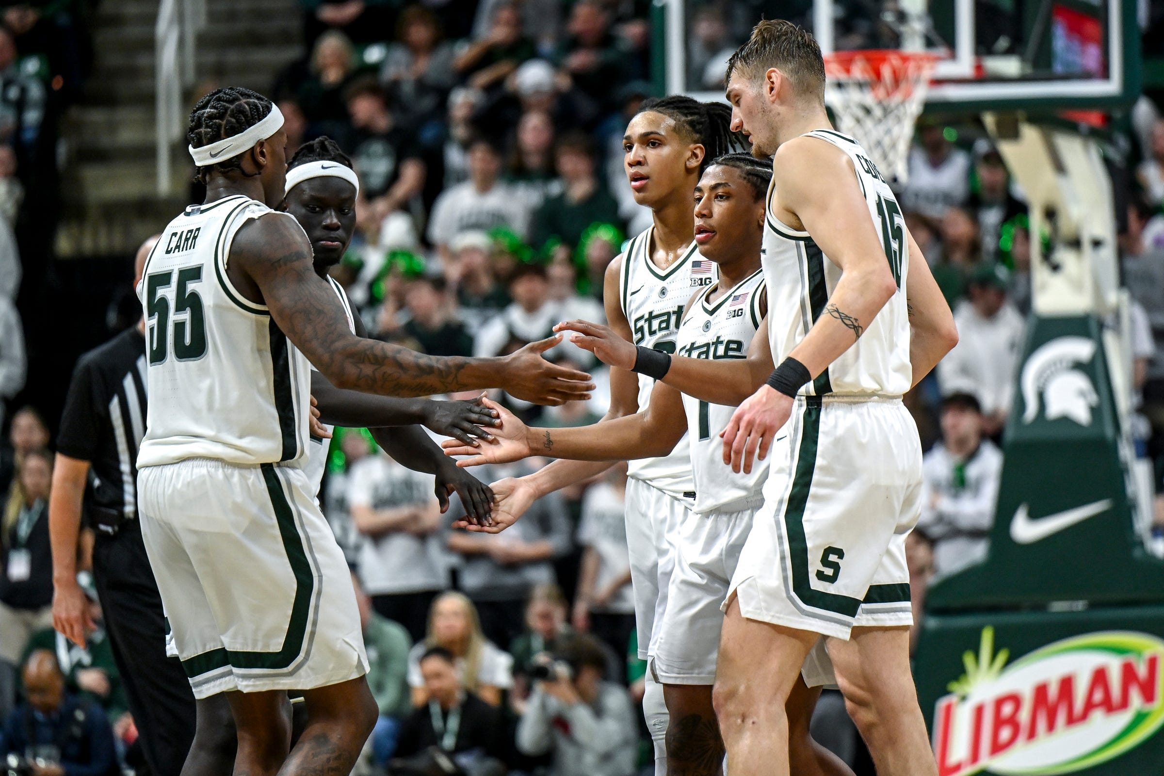 From left, Michigan State's Coen Carr, Kur Teng, Jordan Scott, Jeremy Fears Jr. and Carson Cooper huddle up before a free throw attempt during the second half in the game against Ohio State on Sunday, Feb. 22, 2026, at the Breslin Center in East Lansing.