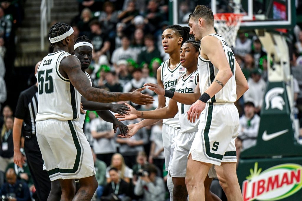 From left, Michigan State's Coen Carr, Kur Teng, Jordan Scott, Jeremy Fears Jr. and Carson Cooper huddle up before a free throw attempt during the second half in the game against Ohio State on Sunday, Feb. 22, 2026, at the Breslin Center in East Lansing.