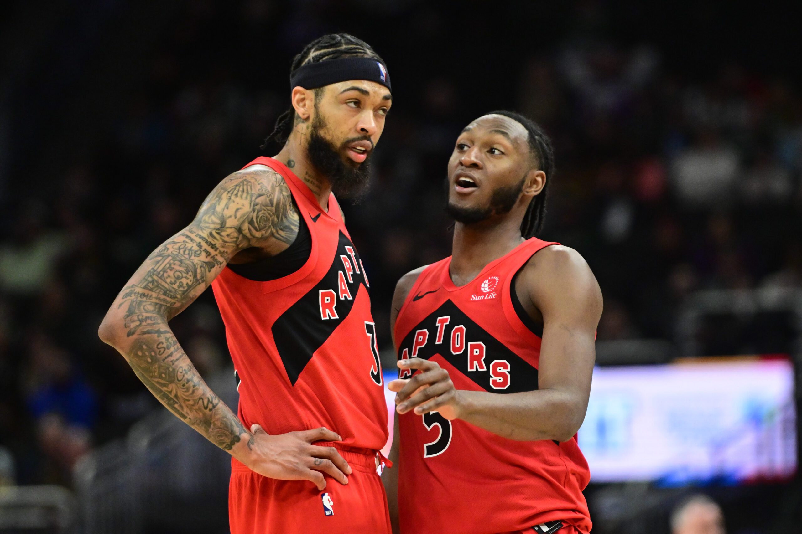Feb 22, 2026; Milwaukee, Wisconsin, USA; Toronto Raptors guard Immanuel Quickley (5) talks to forward Brandon Ingram (3) in the second quarter against the Milwaukee Bucks at Fiserv Forum. Mandatory Credit: Benny Sieu-Imagn Images