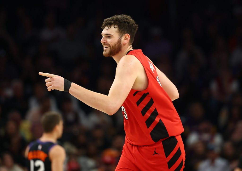 Feb 22, 2026; Phoenix, Arizona, USA; Portland Trail Blazers center Donovan Clingan (23) celebrates a shot against the Phoenix Suns in the first half at Mortgage Matchup Center. Mandatory Credit: Mark J. Rebilas-Imagn Images