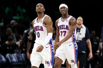 Feb 22, 2026; Minneapolis, Minnesota, USA; Philadelphia 76ers guard Tyrese Maxey (0) and guard Vj Edgecombe (77) look on during the second half against the Minnesota Timberwolves at Target Center. Mandatory Credit: Matt Krohn-Imagn Images