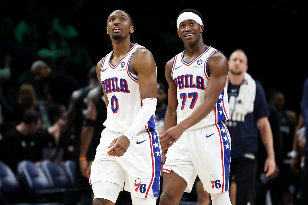 Feb 22, 2026; Minneapolis, Minnesota, USA; Philadelphia 76ers guard Tyrese Maxey (0) and guard Vj Edgecombe (77) look on during the second half against the Minnesota Timberwolves at Target Center. Mandatory Credit: Matt Krohn-Imagn Images