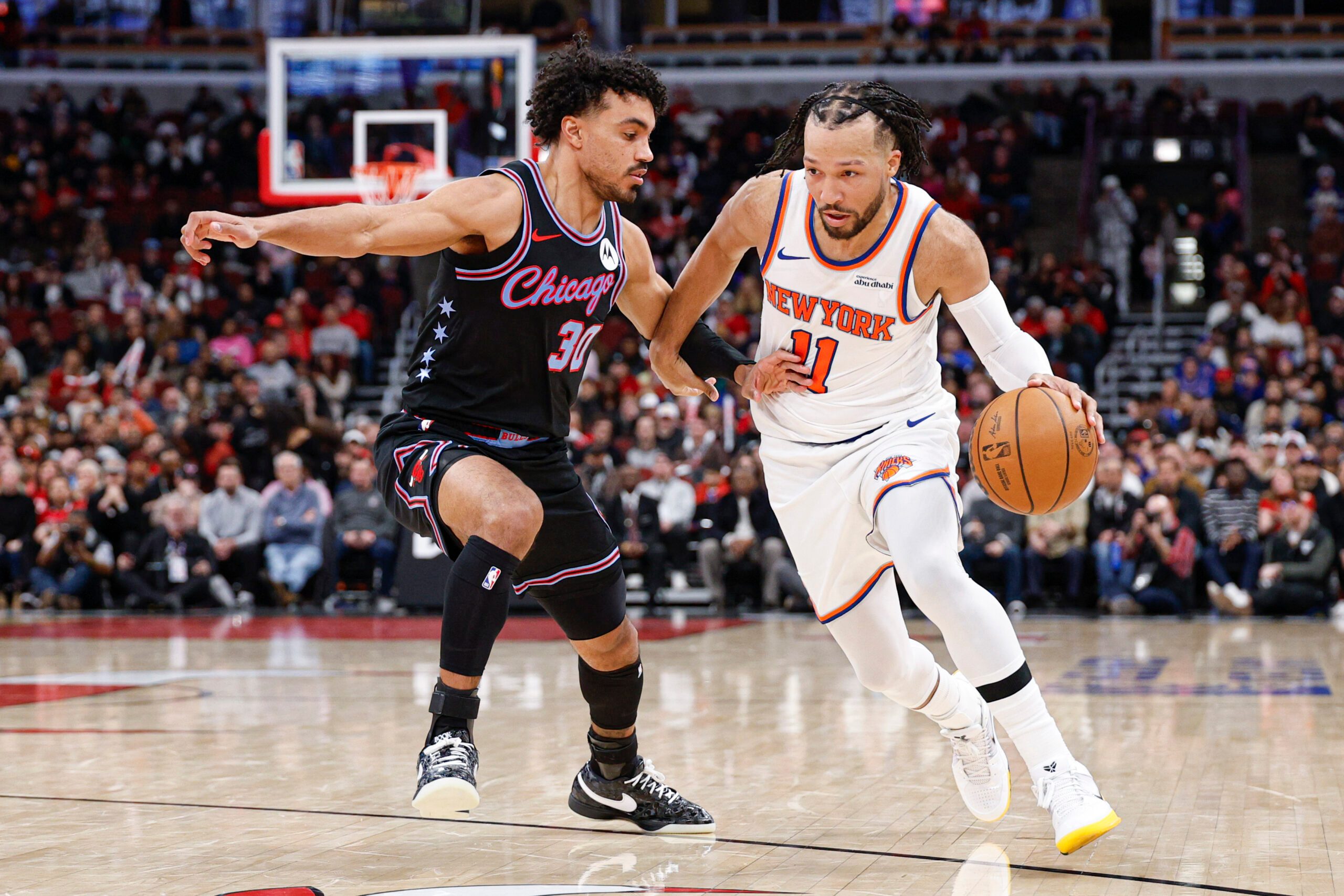 Feb 22, 2026; Chicago, Illinois, USA; New York Knicks guard Jalen Brunson (11) drives to the basket against Chicago Bulls guard Tre Jones (30) during the second half at United Center. Mandatory Credit: Kamil Krzaczynski-Imagn Images