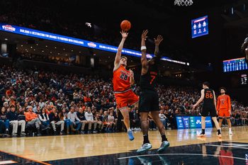 Feb 21, 2026; Charlottesville, Virginia, USA; Virginia Cavaliers forward Thijs de Ridder (28) shoots the ball over Miami (FL) Hurricanes forward Shelton Henderson (7) during the second half at John Paul Jones Arena. Mandatory Credit: Emily Faith Morgan-Imagn Images