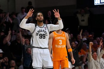 Feb 21, 2026; Nashville, Tennessee, USA;  Vanderbilt Commodores forward Devin McGlockton (99) reacts after a made three point basket made by forward Tyler Nickel (5) against the Tennessee Volunteers during the second half at Memorial Gymnasium. Mandatory Credit: Steve Roberts-Imagn Images