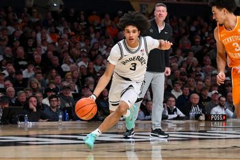 Feb 25, 2026; Nashville, Tennessee, USA;  Vanderbilt Commodores guard Tyler Tanner (3) drives to the basket past Tennessee Volunteers guard Bishop Boswell (3) during the second half at Memorial Gymnasium. Mandatory Credit: Steve Roberts-Imagn Images