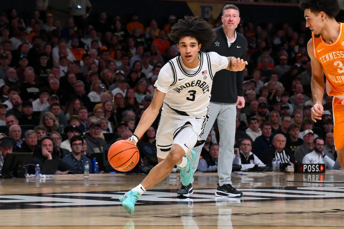 Feb 25, 2026; Nashville, Tennessee, USA; Vanderbilt Commodores guard Tyler Tanner (3) drives to the basket past Tennessee Volunteers guard Bishop Boswell (3) during the second half at Memorial Gymnasium. Mandatory Credit: Steve Roberts-Imagn Images