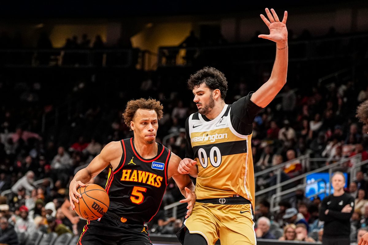 Feb 24, 2026; Atlanta, Georgia, USA; Atlanta Hawks guard Dyson Daniels (5) dribbles against Washington Wizards forward Tristan Vukcevic (00) during the second half at State Farm Arena. Mandatory Credit: Dale Zanine-Imagn Images