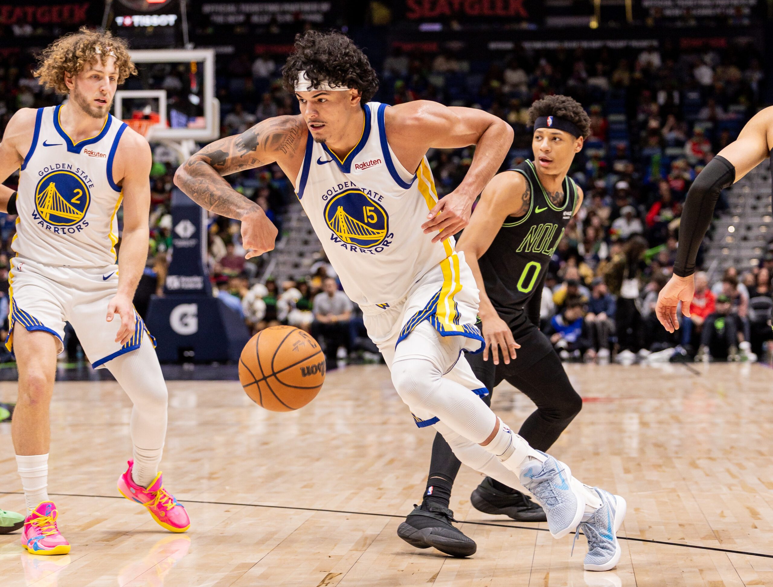 Feb 24, 2026; New Orleans, Louisiana, USA;  Golden State Warriors forward Gui Santos (15) dribbles against New Orleans Pelicans guard Jeremiah Fears (0) during the second half at Smoothie King Center. Mandatory Credit: Stephen Lew-Imagn Images