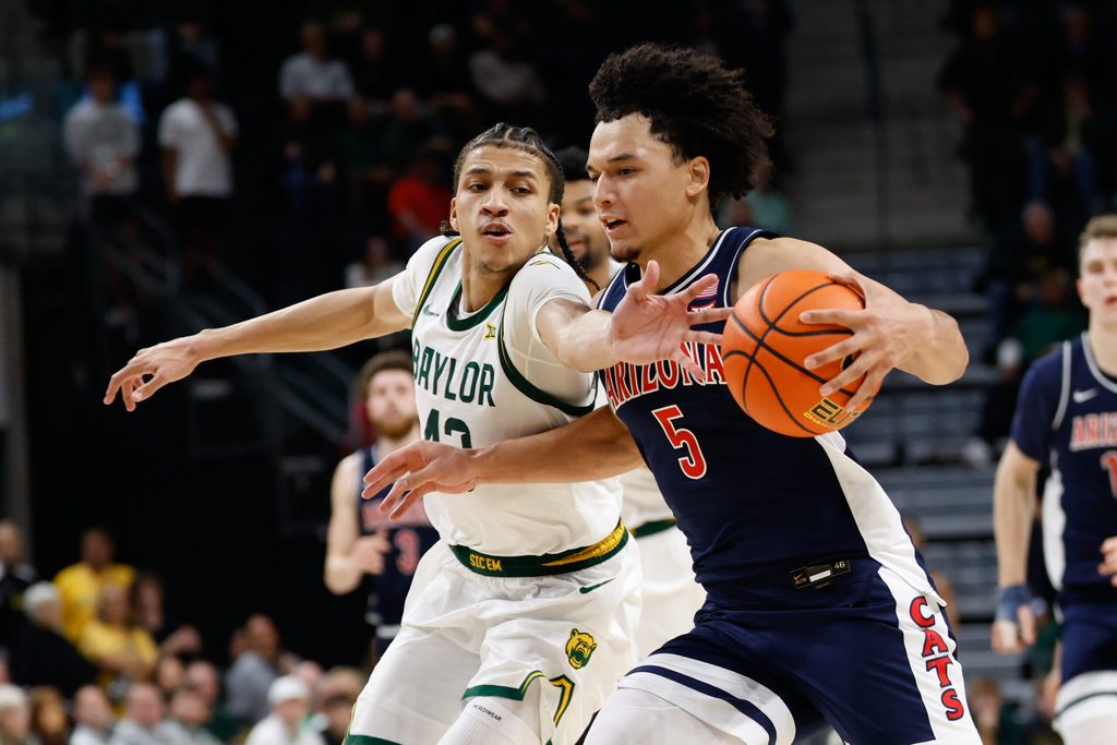 Feb 24, 2026; Waco, Texas, USA; Arizona Wildcats guard Brayden Burries (5) is fouled by Baylor Bears guard Cameron Carr (43) during the second half at Paul and Alejandra Foster Pavilion. Mandatory Credit: Chris Jones-Imagn Images