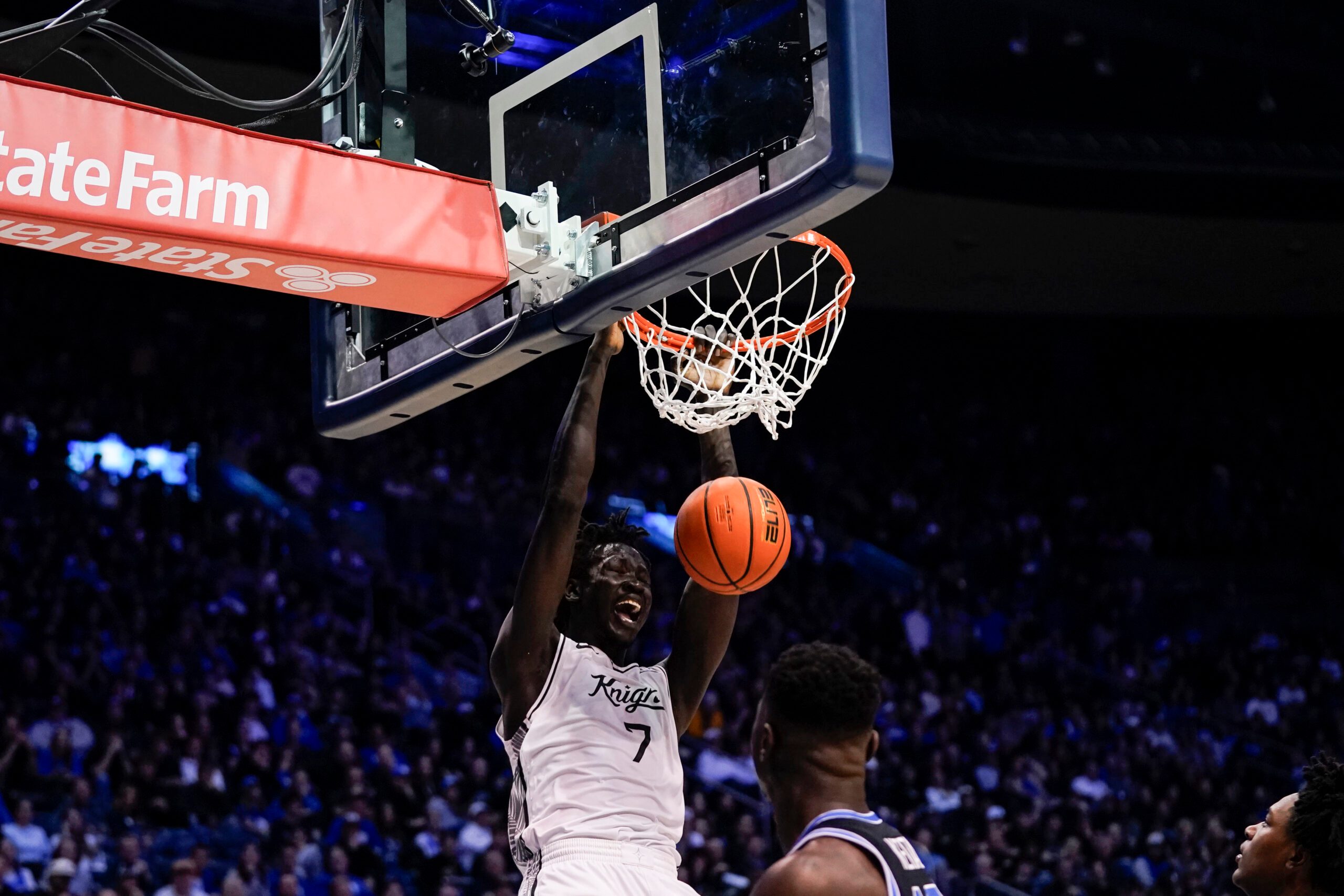 Feb 24, 2026; Provo, Utah, USA; UCF Knights center John Bol (7) dunks during the second half against the BYU Cougars at Marriott Center. Mandatory Credit: Aaron Baker-Imagn Images
