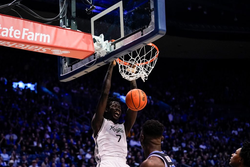 Feb 24, 2026; Provo, Utah, USA; UCF Knights center John Bol (7) dunks during the second half against the BYU Cougars at Marriott Center. Mandatory Credit: Aaron Baker-Imagn Images