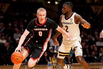Georgia guard Blue Cain (0) bolts apst Vanderbilt guard Duke Miles (2) during the first half at Memorial Gym in Nashville, Tenn., Wednesday, Feb. 25, 2026.