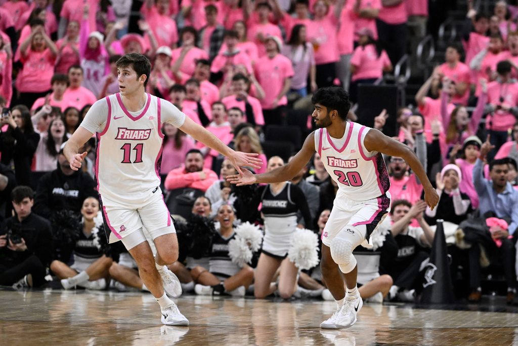 Feb 25, 2026; Providence, Rhode Island, USA; Providence Friars guard Nilavan Daniels (20) celebrates a basket against the Xavier Musketeers with guard Ryan Mela (11) during the second half at Amica Mutual Pavilion. Mandatory Credit: Eric Canha-Imagn Images