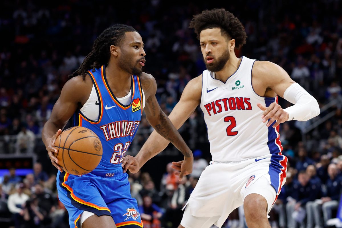 Feb 25, 2026; Detroit, Michigan, USA;  Oklahoma City Thunder guard Cason Wallace (22) dribbles defended by Detroit Pistons guard Cade Cunningham (2) in the second half at Little Caesars Arena. Mandatory Credit: Rick Osentoski-Imagn Images