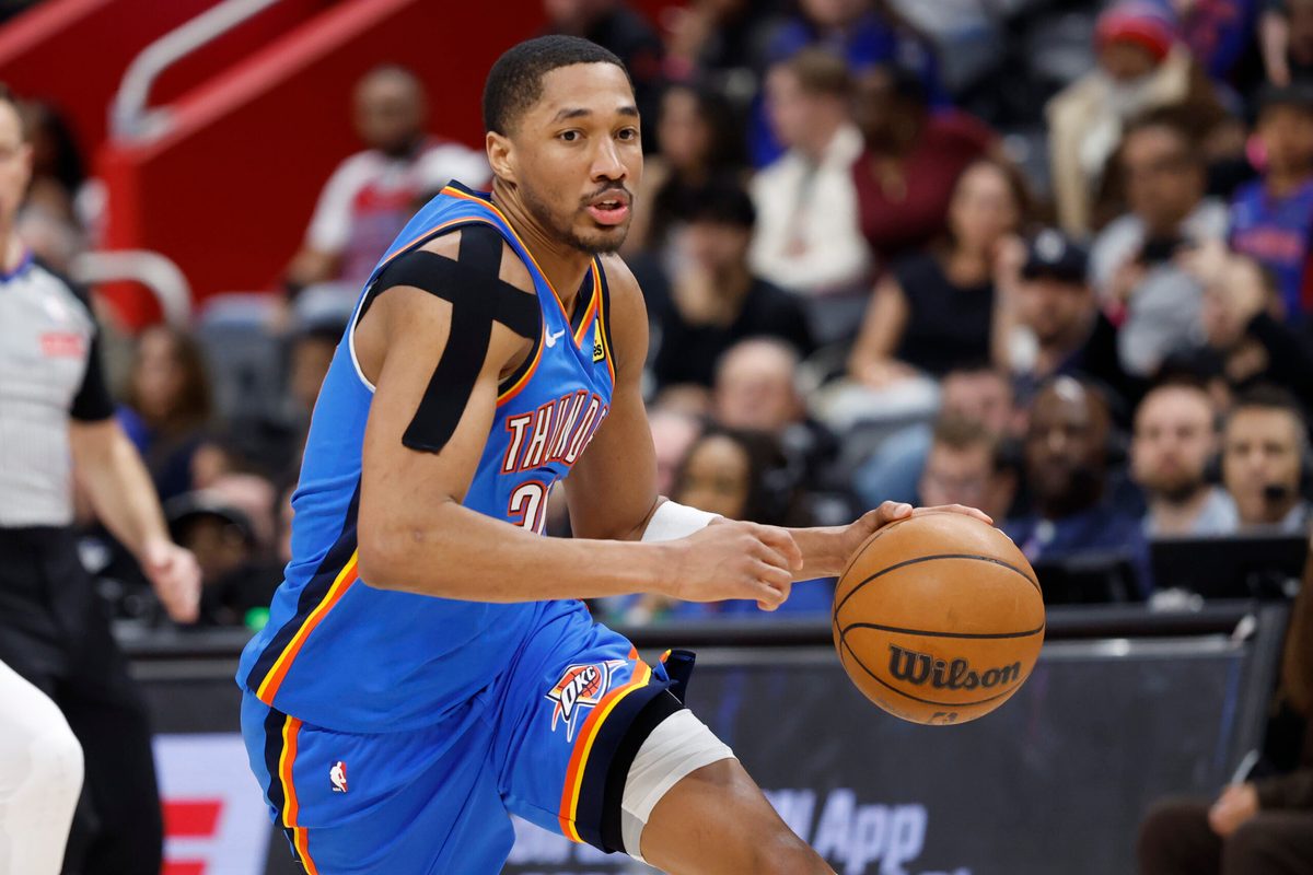 Feb 25, 2026; Detroit, Michigan, USA;  Oklahoma City Thunder guard Aaron Wiggins (21) dribbles in the second half against the Detroit Pistons at Little Caesars Arena. Mandatory Credit: Rick Osentoski-Imagn Images