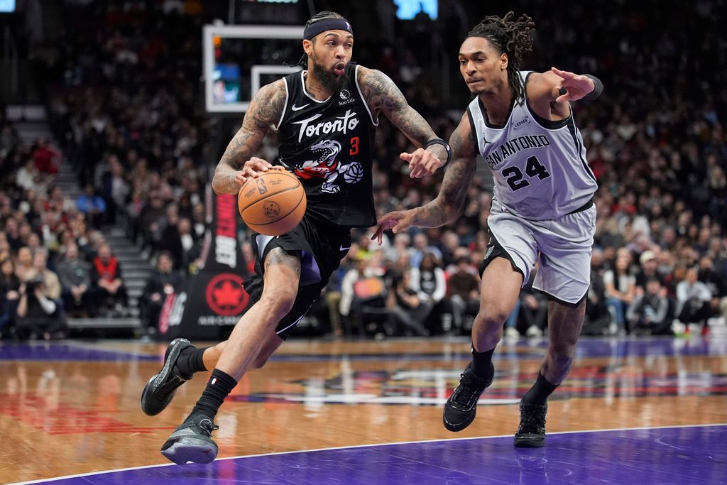Feb 25, 2026; Toronto, Ontario, CAN; Toronto Raptors forward Brandon Ingram (3) drives to the basket against San Antonio Spurs guard Devin Vassell (24) during the second half at Scotiabank Arena. Mandatory Credit: John E. Sokolowski-Imagn Images