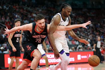 Feb 25, 2026; Houston, Texas, USA; Houston Rockets center Alperen Sengun (28) attempts to get control of the ball away from Sacramento Kings forward Precious Achiuwa (9) during the fourth quarter at Toyota Center. Mandatory Credit: Troy Taormina-Imagn Images