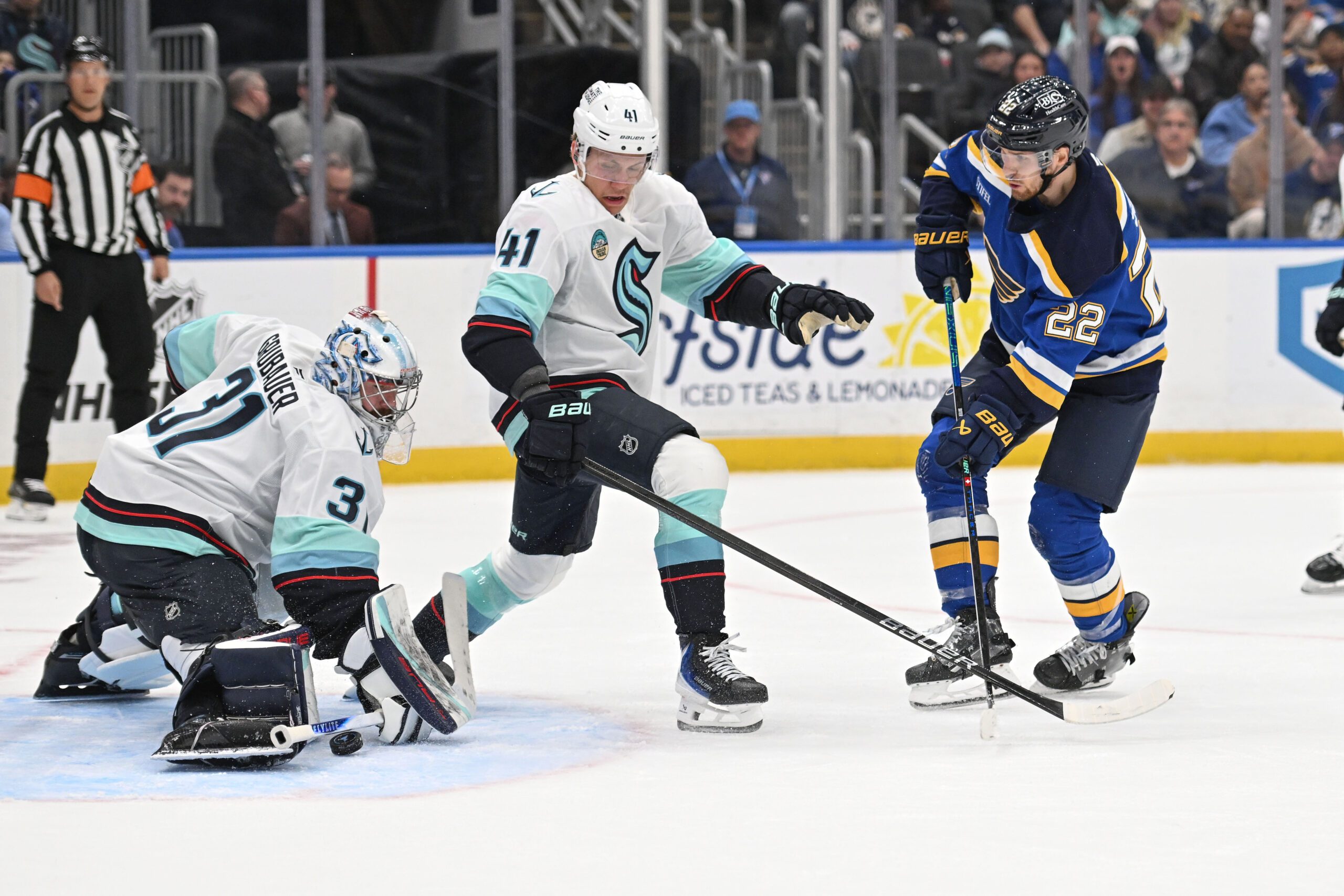 Feb 26, 2026; St. Louis, Missouri, USA; Seattle Kraken goaltender Philipp Grubauer (31) blocks a shot from St. Louis Blues center Pius Suter (22) during the second period at Enterprise Center. Mandatory Credit: Joe Puetz-Imagn Images