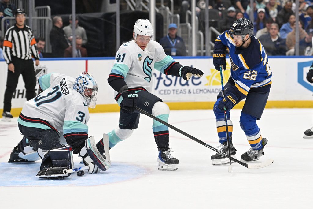 Feb 26, 2026; St. Louis, Missouri, USA; Seattle Kraken goaltender Philipp Grubauer (31) blocks a shot from St. Louis Blues center Pius Suter (22) during the second period at Enterprise Center. Mandatory Credit: Joe Puetz-Imagn Images
