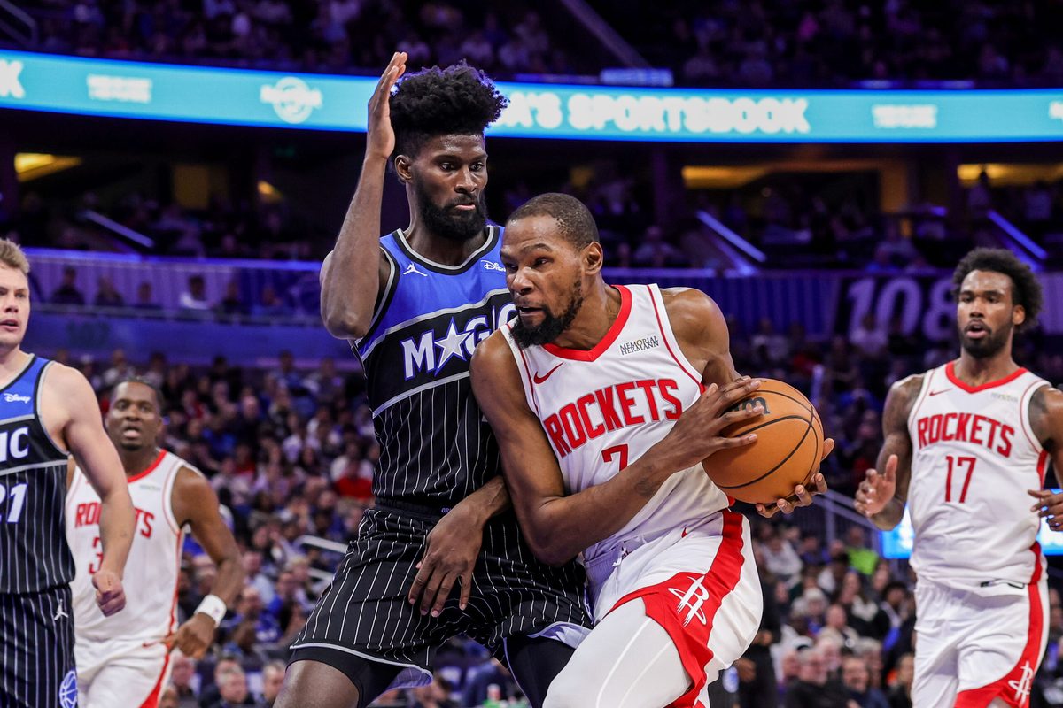 Feb 26, 2026; Orlando, Florida, USA; Houston Rockets forward Kevin Durant (7) is fouled by Orlando Magic forward Jonathan Isaac (1) during the second half at Kia Center. Mandatory Credit: Mike Watters-Imagn Images