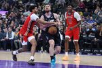 Feb 26, 2026; Salt Lake City, Utah, USA; Utah Jazz guard Svi Mykhailiuk (middle) has the ball knocked away by New Orleans Pelicans guard Jordan Poole (left) during the second half at Delta Center. Mandatory Credit: Rob Gray-Imagn Images