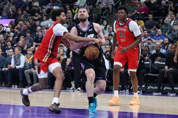 Feb 26, 2026; Salt Lake City, Utah, USA; Utah Jazz guard Svi Mykhailiuk (middle) has the ball knocked away by New Orleans Pelicans guard Jordan Poole (left) during the second half at Delta Center. Mandatory Credit: Rob Gray-Imagn Images