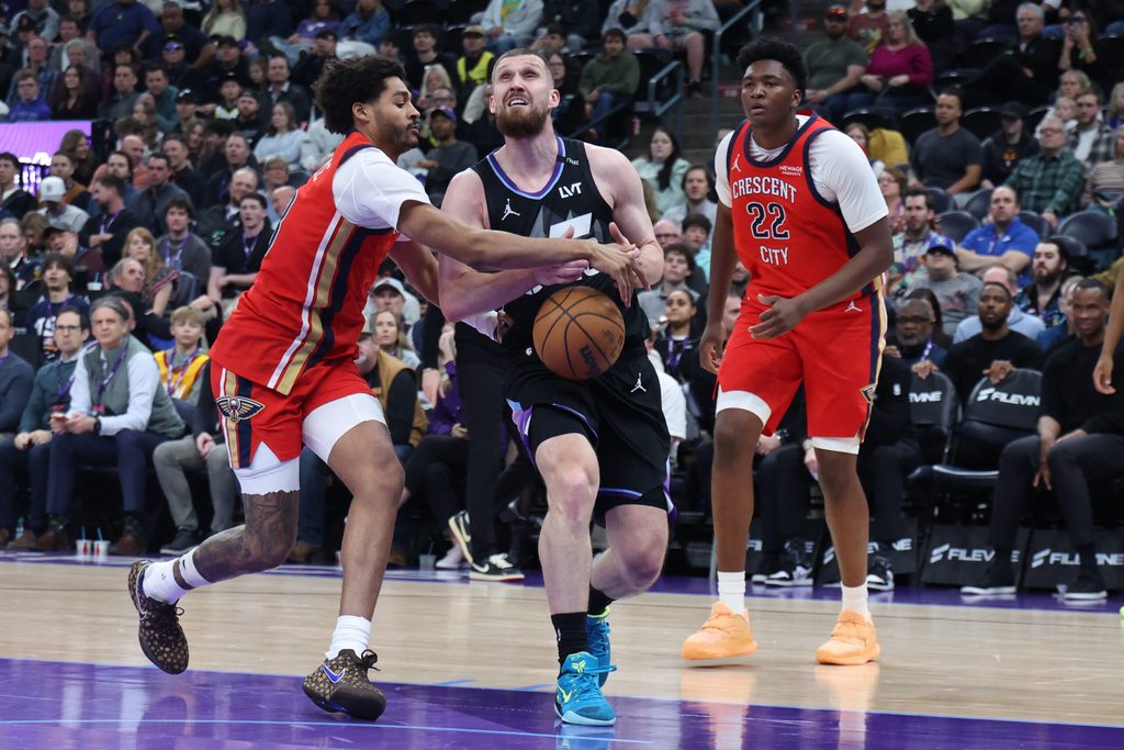 Feb 26, 2026; Salt Lake City, Utah, USA; Utah Jazz guard Svi Mykhailiuk (middle) has the ball knocked away by New Orleans Pelicans guard Jordan Poole (left) during the second half at Delta Center. Mandatory Credit: Rob Gray-Imagn Images