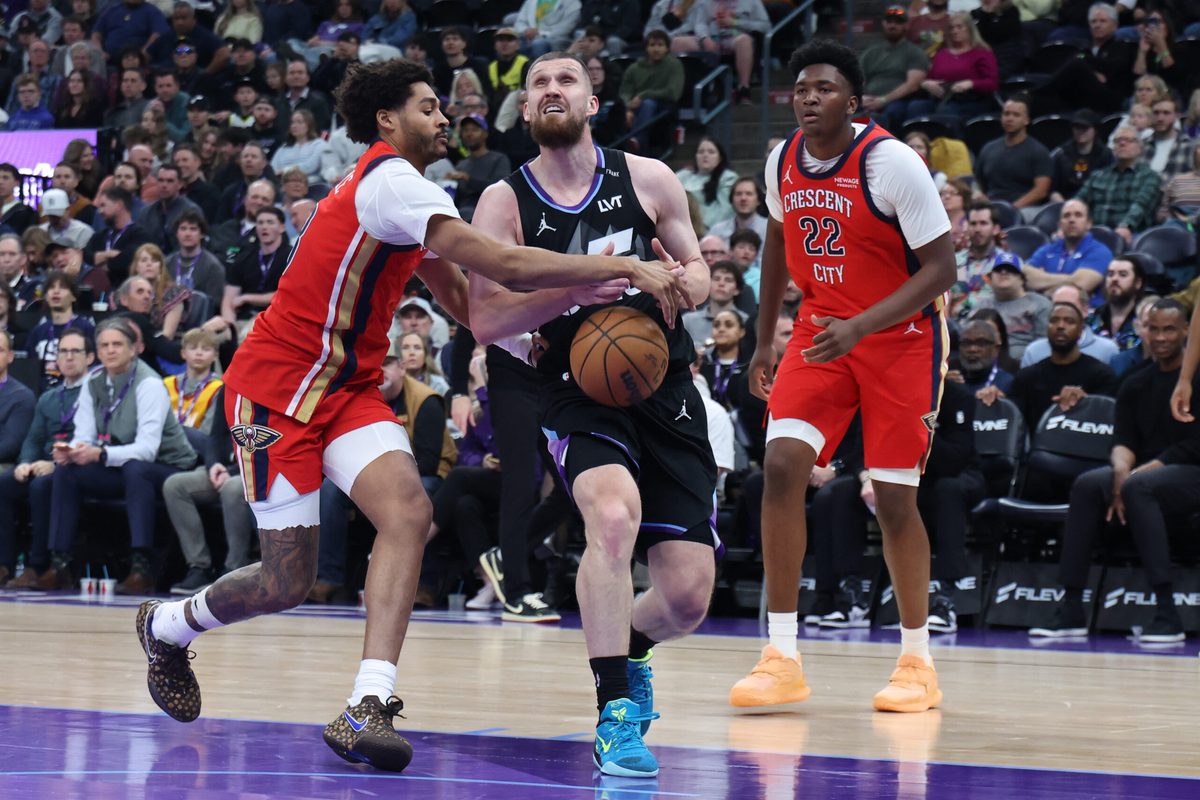 Feb 26, 2026; Salt Lake City, Utah, USA; Utah Jazz guard Svi Mykhailiuk (middle) has the ball knocked away by New Orleans Pelicans guard Jordan Poole (left) during the second half at Delta Center. Mandatory Credit: Rob Gray-Imagn Images