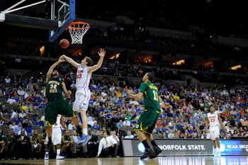 Mar 18, 2012; Omaha, NE, USA; Florida Gators forward Erik Murphy (33) blocks the shot of Norfolk State Spartans forward Marcos Tamares (32) during the second half in the third round of the 2012 NCAA men's basketball tournament at the CenturyLink Center.  Florida defeated Norfolk State 84-50.  Mandatory Credit: Peter G. Aiken-Imagn Images