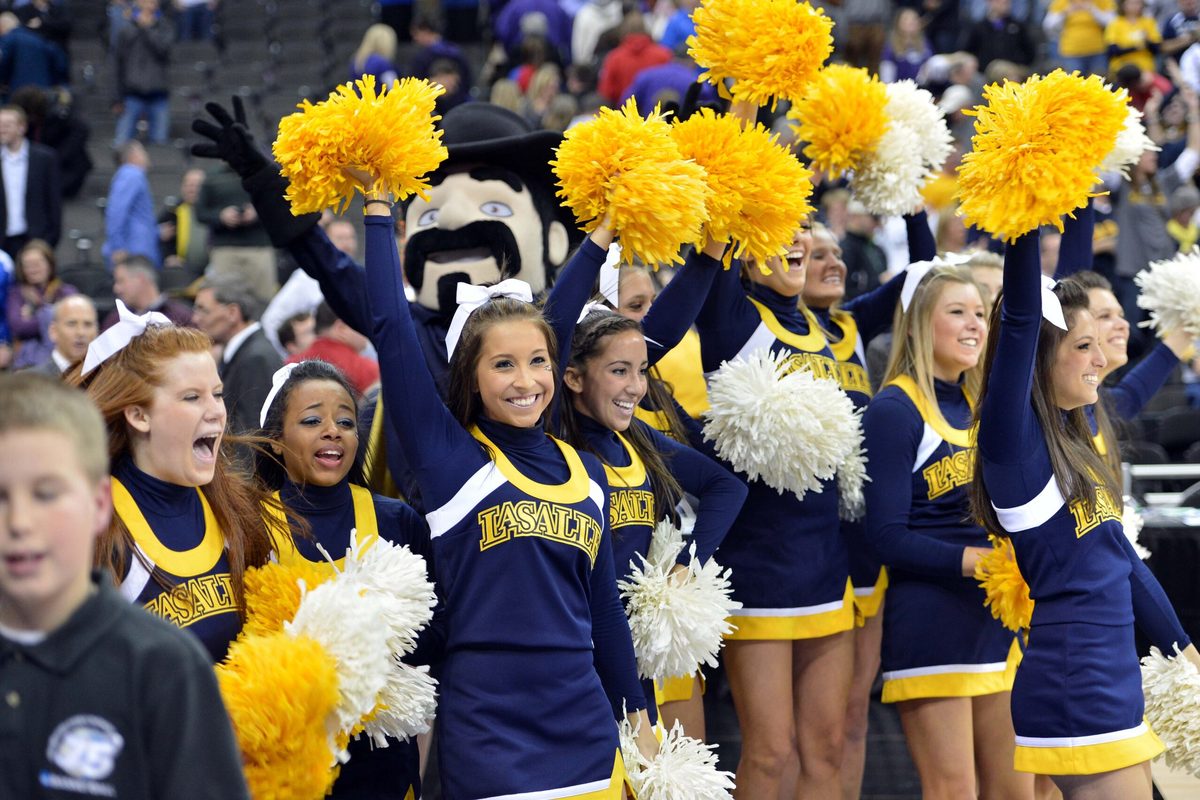 Mar 22, 2013; Kansas City, MO, USA; La Salle Explorers cheerleaders celebrate after beating the Kansas State Wildcats 63-61 during the second round of the 2013 NCAA tournament at the Sprint Center. Mandatory Credit: Peter G. Aiken-Imagn Images
