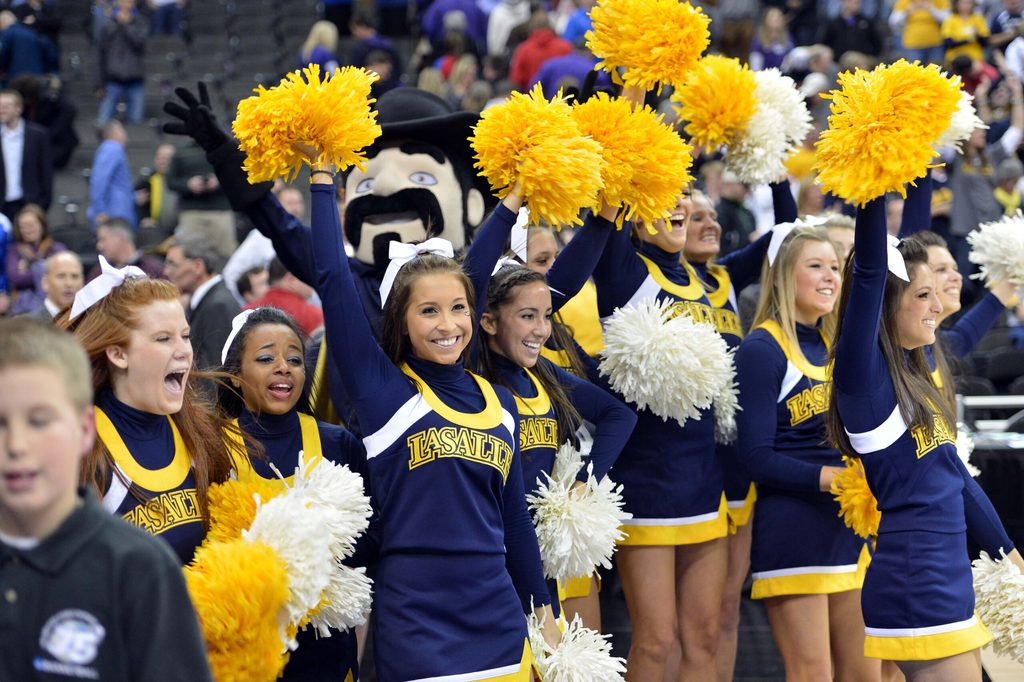 Mar 22, 2013; Kansas City, MO, USA; La Salle Explorers cheerleaders celebrate after beating the Kansas State Wildcats 63-61 during the second round of the 2013 NCAA tournament at the Sprint Center. Mandatory Credit: Peter G. Aiken-Imagn Images
