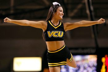 Jan 29, 2014; Richmond, VA, USA; A Virginia Commonwealth Rams cheerleader cheers during a stoppage in play against the Fordham Rams in the first half at Stuart C. Siegel Center. The Rams won 76-60. Mandatory Credit: Geoff Burke-Imagn Images