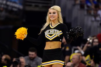 Mar 22, 2015; Omaha, NE, USA; Wichita State Shockers cheerleader performs against the Kansas Jayhawks during the second half in the third round of the 2015 NCAA Tournament at CenturyLink Center. Mandatory Credit: Jasen Vinlove-Imagn Images