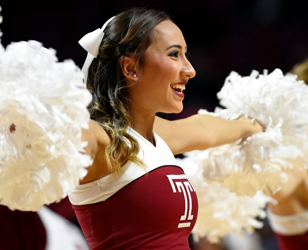 Nov 29, 2015; Philadelphia, PA, USA; Temple Owls cheerleader performs during a timeout against the Delaware Fightin Blue Hens the first half at Liacouras Center. Mandatory Credit: Eric Hartline-Imagn Images