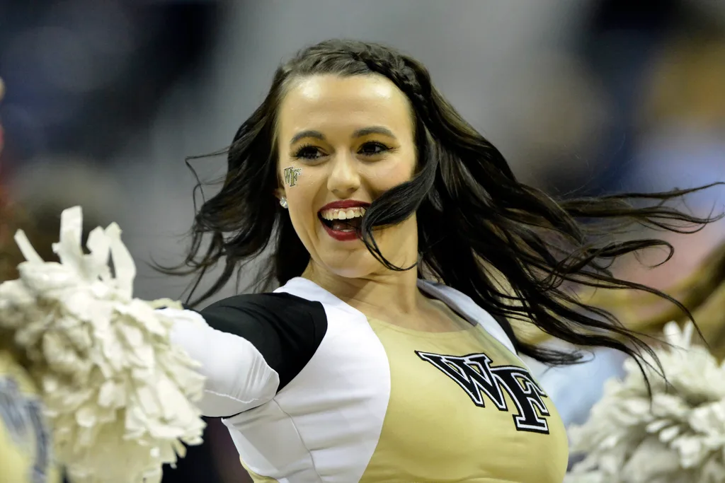 Mar 8, 2016; Washington, DC, USA; Wake Forest Demon Deacons cheerleaders perform in the second half against the North Carolina State Wolfpack during round one of the ACC tournament at Verizon Center. North Carolina State Wolfpack defeated Wake Forest Demon Deacons 75-72. Mandatory Credit: Tommy Gilligan-Imagn Images