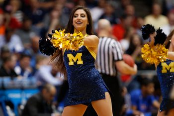 Mar 16, 2016; Dayton, OH, USA; Michigan Wolverines cheerleader performs during the first half against the Tulsa Golden Hurricane in the First Four of the NCAA men's college basketball tournament at Dayton Arena. Mandatory Credit: Rick Osentoski-Imagn Images