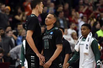 March 20, 2016; Spokane , WA, USA; Hawaii Rainbow Warriors forward Stefan Jankovic (33) and guard Quincy Smith (11) react following the 73-60 loss against Maryland Terrapins in the second round of the 2016 NCAA Tournament at Spokane Veterans Memorial Arena. Mandatory Credit: Kyle Terada-Imagn Images