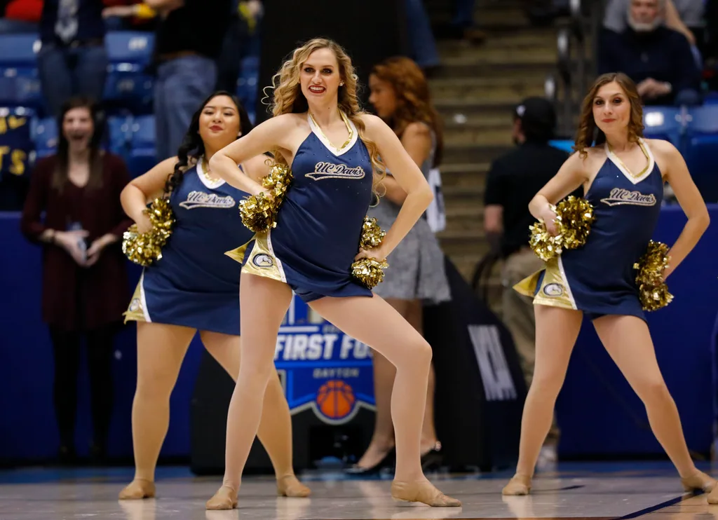 Mar 15, 2017; Dayton, OH, USA; UC Davis Aggies cheerleaders in the first half against the North Carolina Central Eagles in the first four of the 2017 NCAA Tournament at Dayton Arena. Mandatory Credit: Rick Osentoski-Imagn Images