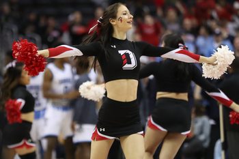 Mar 11, 2018; Washington, DC, USA; A Davidson Wildcats cheerleader dances on the court during a timeout against the Rhode Island Rams in the second half in the championship game of the Atlantic 10 conference tournament at Capital One Arena. The Wildcats won 58-57. Mandatory Credit: Geoff Burke-Imagn Images
