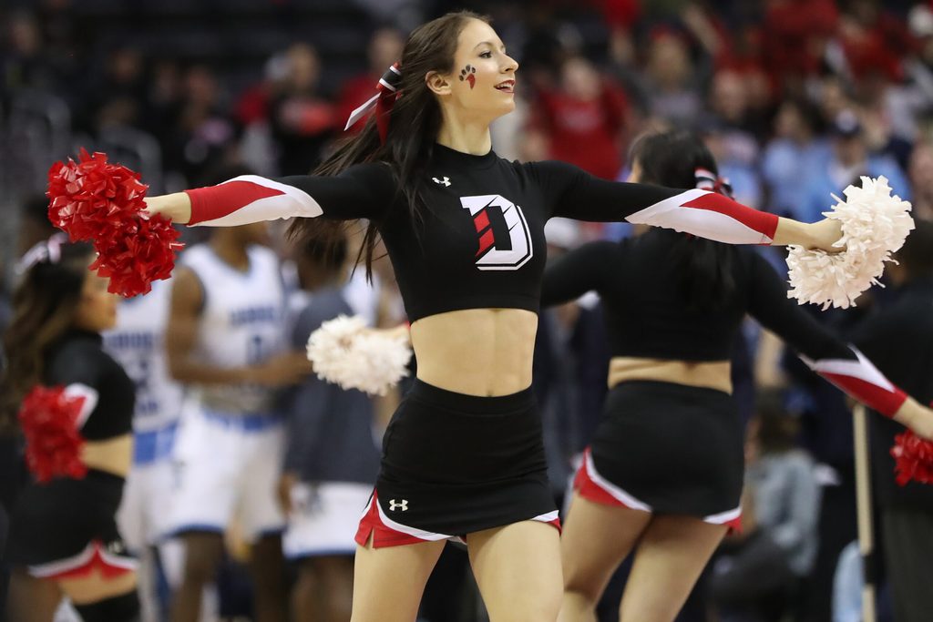 Mar 11, 2018; Washington, DC, USA; A Davidson Wildcats cheerleader dances on the court during a timeout against the Rhode Island Rams in the second half in the championship game of the Atlantic 10 conference tournament at Capital One Arena. The Wildcats won 58-57. Mandatory Credit: Geoff Burke-Imagn Images