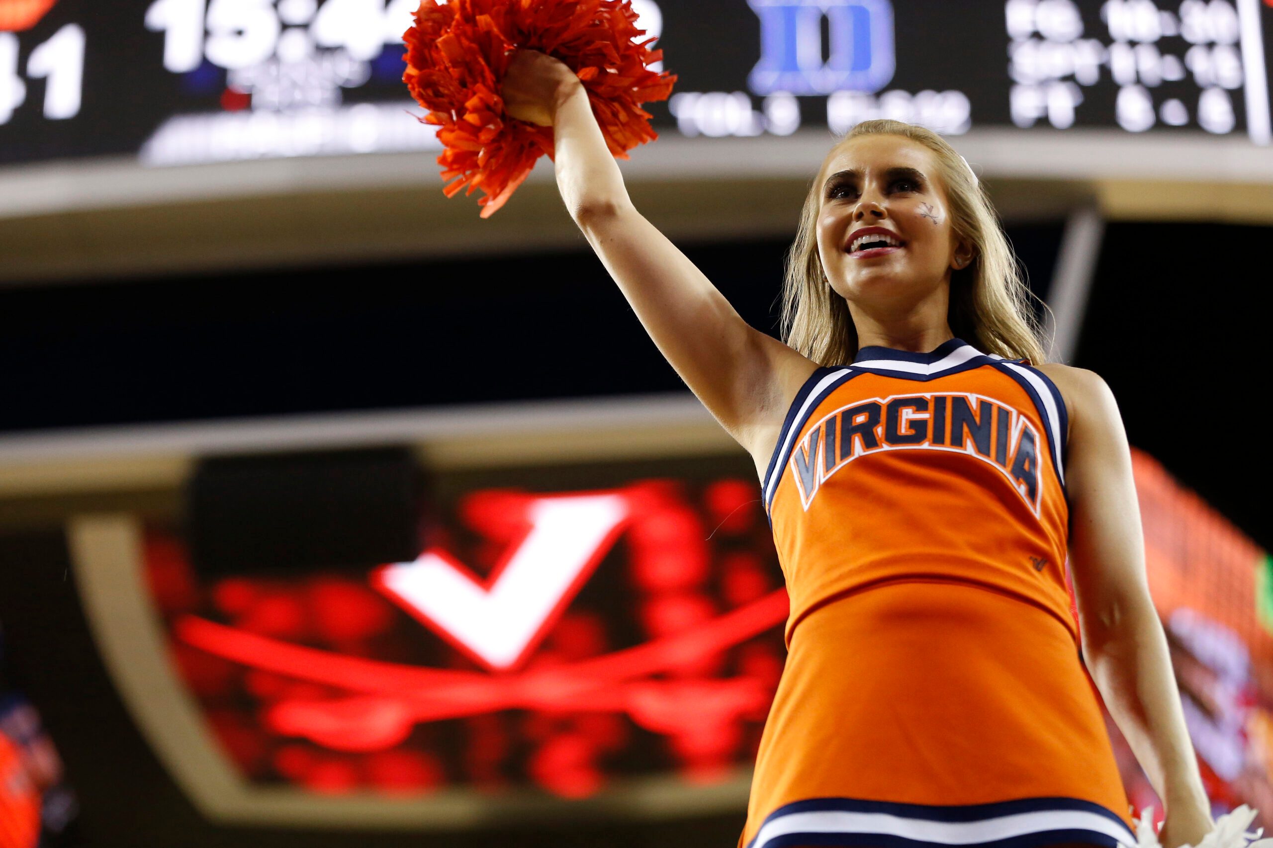 Feb 9, 2019; Charlottesville, VA, USA; A Virginia Cavaliers cheerleader cheers on the court during a timeout against the Duke Blue Devils in the second half at John Paul Jones Arena. The Blue Devils won 81-71. Mandatory Credit: Geoff Burke-Imagn Images
