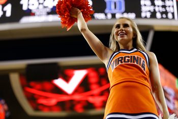 Feb 9, 2019; Charlottesville, VA, USA; A Virginia Cavaliers cheerleader cheers on the court during a timeout against the Duke Blue Devils in the second half at John Paul Jones Arena. The Blue Devils won 81-71. Mandatory Credit: Geoff Burke-Imagn Images