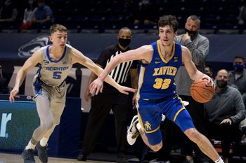 Xavier Musketeers forward Zach Freemantle (32) drives passed Creighton Bluejays guard Alex O'Connell (5) in the first half of the men's NCAA basketball game on Saturday, Feb. 27, 2021, at the Cintas Center in Cincinnati.

Xavier Musketeers Creighton Bluejays