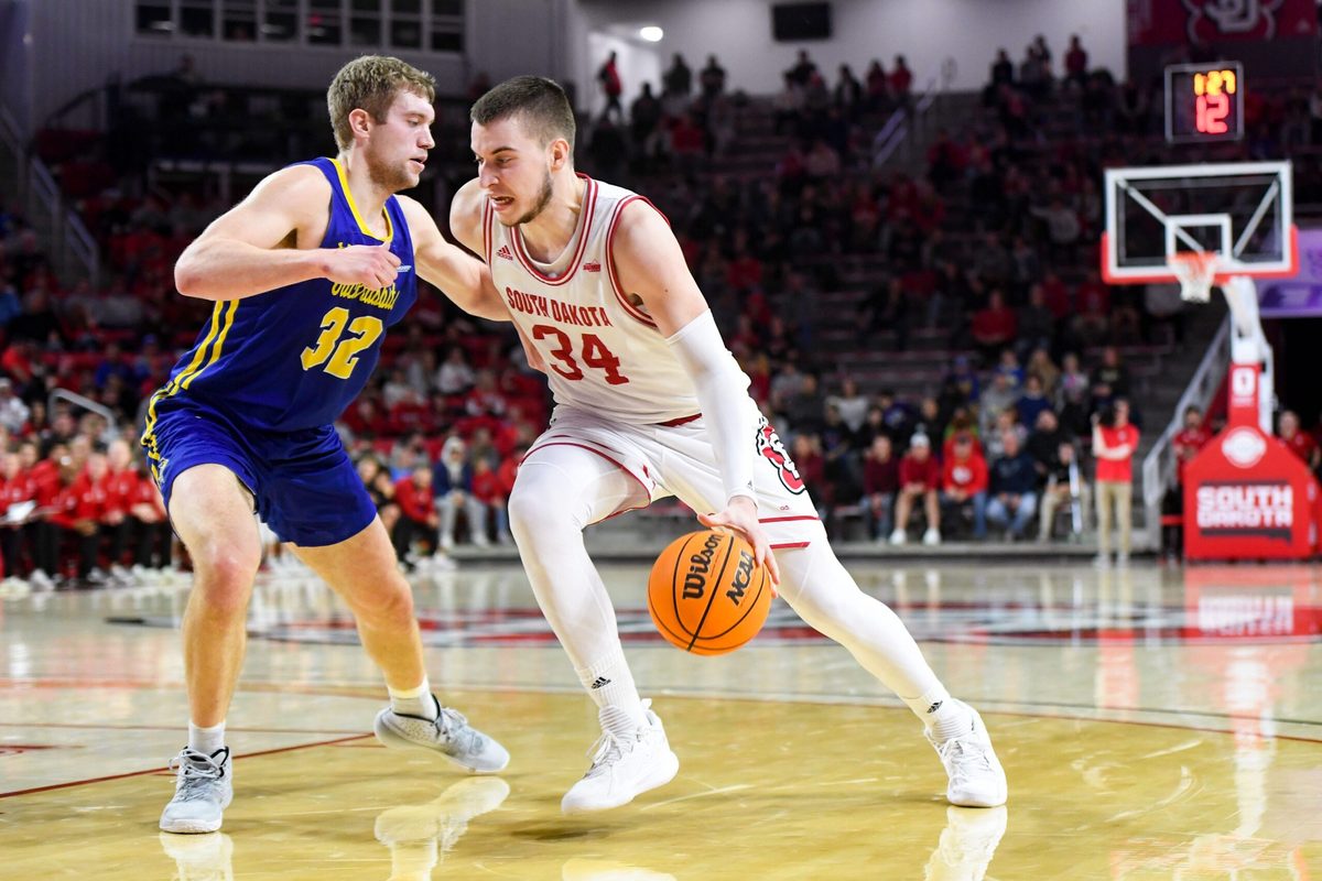 South Dakota State   s Matt Dentlinger guards South Dakota   s Tasos Kamateros in a rivalry matchup on Saturday, January 14, 2023, at the Sanford Coyote Sports Center in Vermillion.

Men Rivalry Bball 017